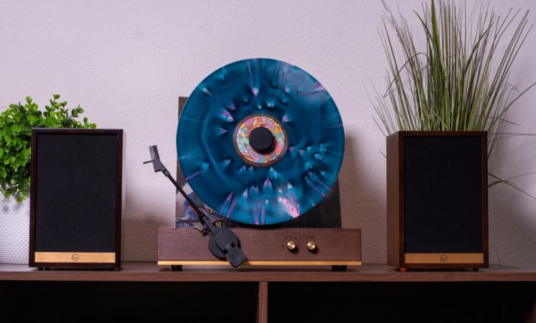 I doubt this retro-style vertical turntable and speakers combo is a good idea, but doesn’t it look incredible?