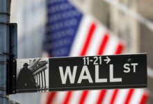 Wall Street closes lower on trade war escalation, weak data