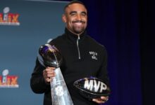 Super Bowl MVP Jalen Hurts celebrates at Disney World