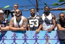 Saints players ride in the Krewe of Tucks