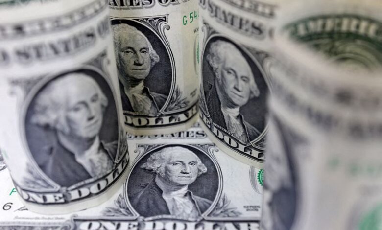Dollar slides on easing trade tensions, Fed expectations