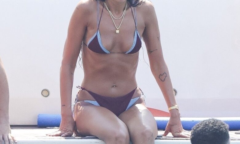 Bikini-clad Dua Lipa flaunts shredded abs during paddleboard yoga in Ibiza