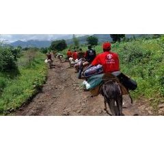 SUDAN: Aid Workers on Donkeys Deliver First Emergency Supplies to Village Cut Off by Landslide