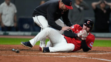Guardians' David Fry carted off field after being hit in face by pitch while trying to bunt